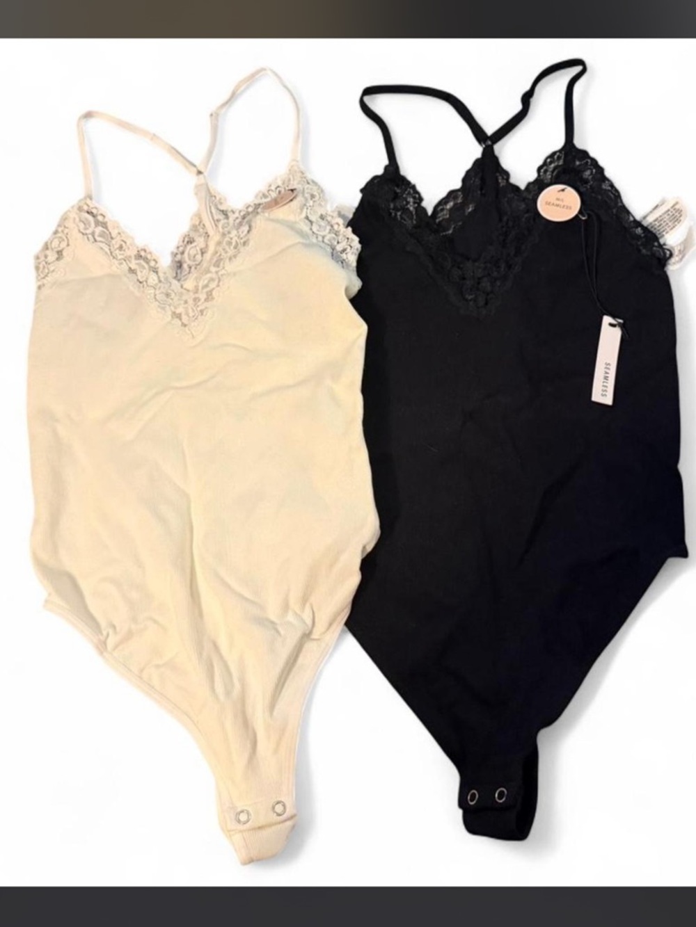 2 seamless lace-trim bodysuits from Forever 21 black and white size M/L NWT